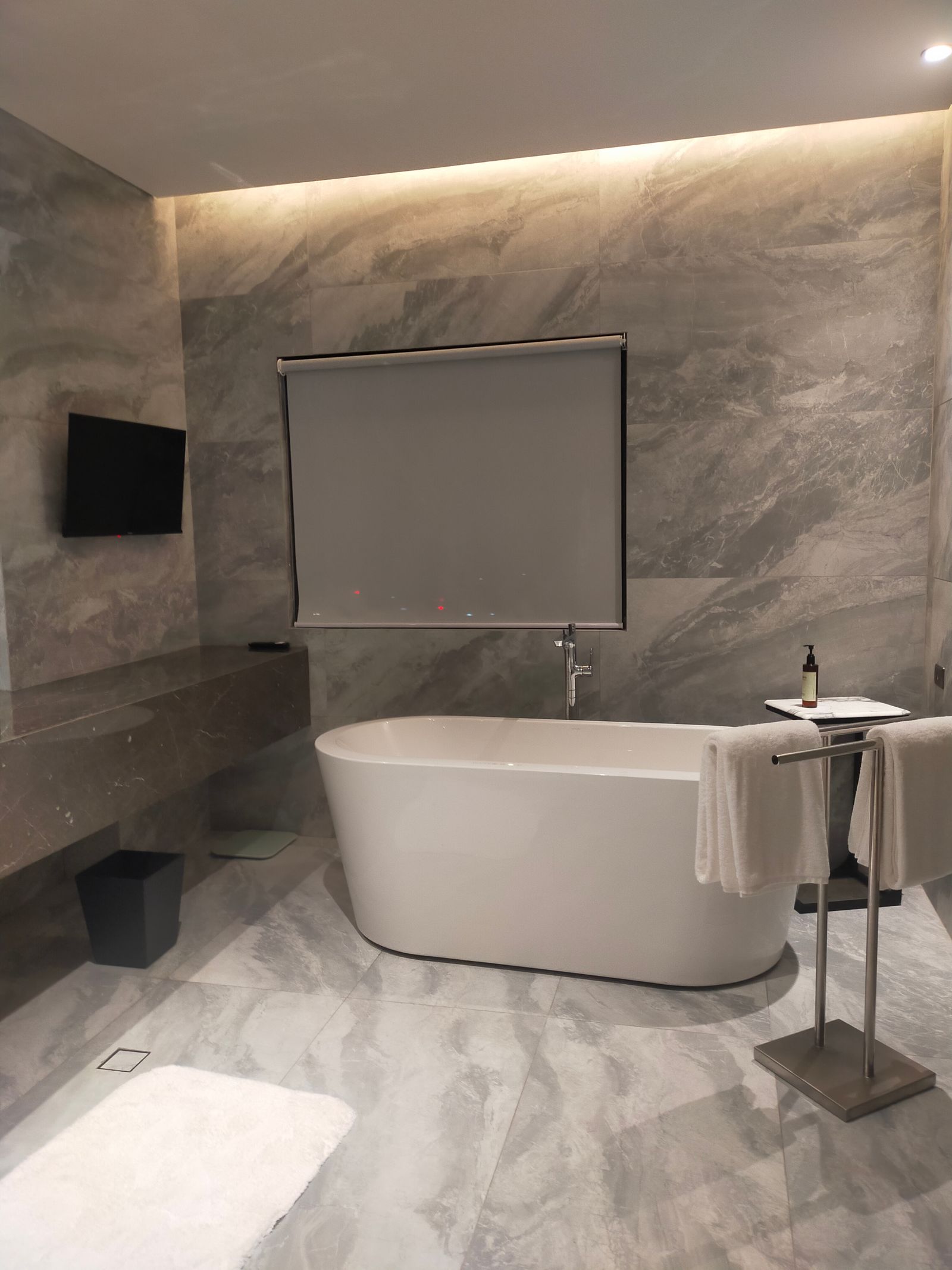 Marble bathroom with freestanding tub